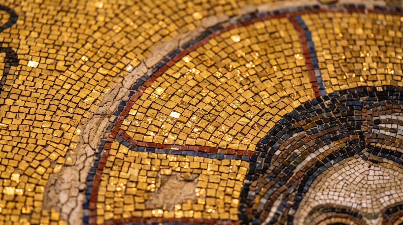 Golden Byzantine mosaic detail inside Hagia Sophia with glittering gold tesserae